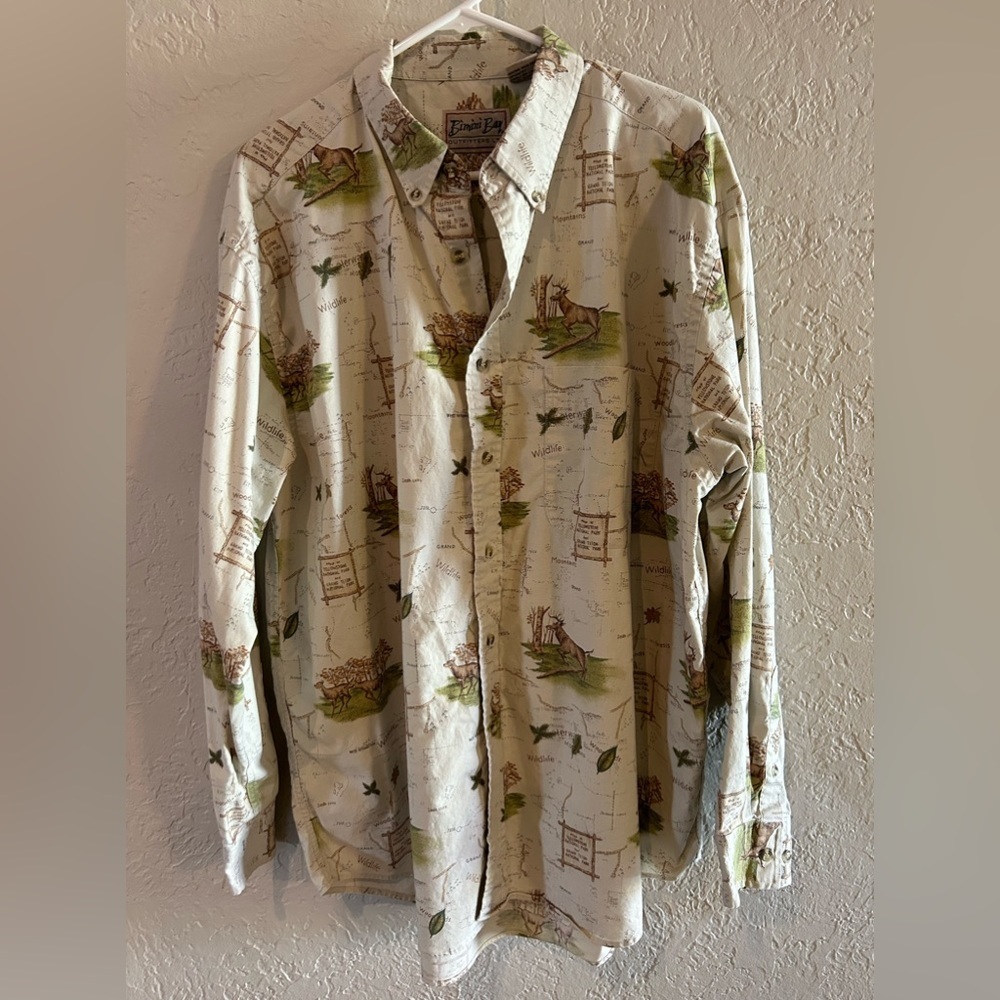Tan shirt with deer and map pictures -long sleeve with buttons. Size XL